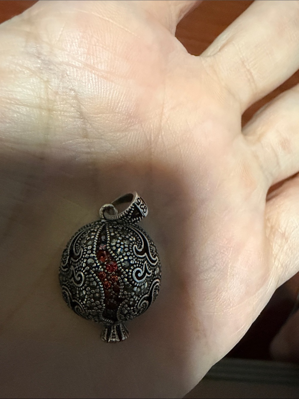 Intricate Silver-Tone Filigree Pendant with Red Accent